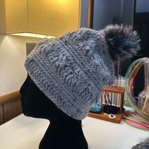 A bundle of hats and a bag.